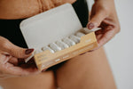 Load image into Gallery viewer, An open box of joni super plus tampons held by a person who menstruates,
